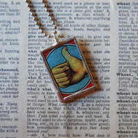 Thumbs up, vintage matchbox illustration, upcycled to hand-soldered glass pendant