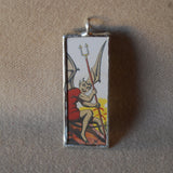 Winged Devil illustration, upcycled to hand-soldered glass pendant
