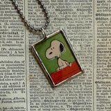 Snoopy, comic strip illustrations from vintage Peanuts book, up-cycled to hand-soldered glass pendant