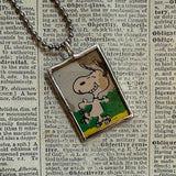 Snoopy, comic strip illustrations from vintage Peanuts book, up-cycled to hand-soldered glass pendant