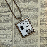 Snoopy, comic strip illustrations from vintage Peanuts book, up-cycled to hand-soldered glass pendant