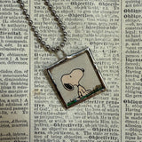 Snoopy, comic strip illustrations from vintage Peanuts book, up-cycled to hand-soldered glass pendant
