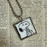 Snoopy, comic strip illustrations from vintage Peanuts book, up-cycled to hand-soldered glass pendant