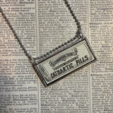 Cathartic Pills, vintage Sears Catalog illustrations, upcycled to hand soldered glass pendant