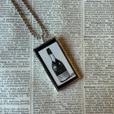 Champagne bottles, antique woodcut illustrations, up-cycled to soldered glass pendant