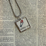 Ink spot and safety pin, original illustrations from vintage Richard Scarry book, up-cycled to soldered glass pendant