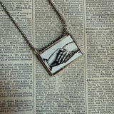Handshakes, antique woodcut illustrations up-cycled to soldered glass pendant