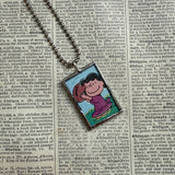 Charlie Brown and Lucy, comic strip illustrations from vintage Peanuts book, up-cycled to hand-soldered glass pendant