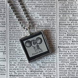 Dumb-bell, 1930s dictionary illustration upcycled to soldered glass pendant