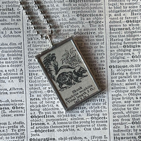 Skunk, vintage 1940s dictionary illustration, up-cycled to hand-soldered glass pendant