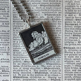 Cumulus clouds, vintage dictionary illustration, upcycled to soldered glass pendant