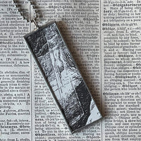 Finger of God, Gorey illustration, hand-soldered glass pendant