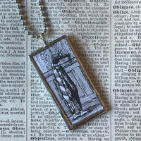 Gorey Doubtful Guest illustrations, hand-soldered glass pendant