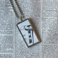 Gorey bird and man, vintage book illustrations, hand-soldered glass pendant