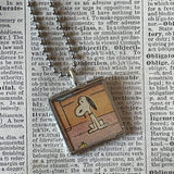 Snoopy, comic strip illustrations from vintage Peanuts book, up-cycled to hand-soldered glass pendant