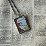 Snoopy, comic strip illustrations from vintage Peanuts book, up-cycled to hand-soldered glass pendant