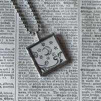 Sun and Moon, antique woodcut illustrations, upcycled to soldered glass pendant