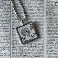 Sun and Moon, antique woodcut illustrations, upcycled to soldered glass pendant