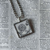 Sun and Moon, antique woodcut illustrations, upcycled to soldered glass pendant
