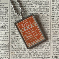 Sewing needle vintage packaging typography,  upcycled to soldered glass pendant