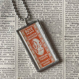 Sewing needle vintage packaging typography,  upcycled to soldered glass pendant