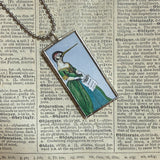 Hummingbird in fancy dress, vintage illustrations, up-cycled to soldered glass pendant