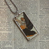Woman flying on a blackbird and hollyhock flowers, vintage illustrations, up-cycled to soldered glass pendant