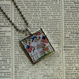 Antique quilt with flag and bird designs, upcycled to hand-soldered glass pendant