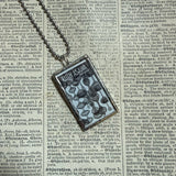 Ruth Asawa postage stamps upcycled to hand soldered glass pendant