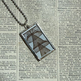 Ruth Asawa postage stamps upcycled to hand soldered glass pendant