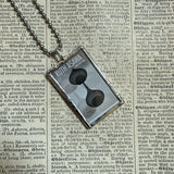 Ruth Asawa postage stamps upcycled to hand soldered glass pendant
