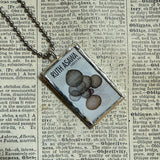 Ruth Asawa postage stamps upcycled to hand soldered glass pendant