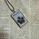 Ruth Asawa postage stamps upcycled to hand soldered glass pendant