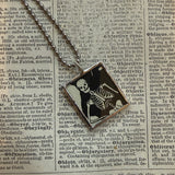 Pumpkin / jack o lantern and skeleton, vintage children's book illustrations, upcycled to soldered glass pendant