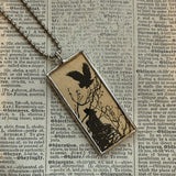 Silhouettes of bat and owl, vintage children's book illustrations, upcycled to soldered glass pendant