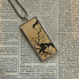 Silhouettes of bat and owl, vintage children's book illustrations, upcycled to soldered glass pendant