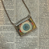 Human eye, anatomical illustrations up-cycled to soldered glass pendant