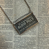 Blood Pills, vintage Sears Catalog illustrations, upcycled to hand soldered glass pendant