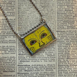 Human eye, buddhist art up-cycled to soldered glass pendant