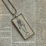 Skeleton vintage dictionary illustration, upcycled to soldered glass pendant