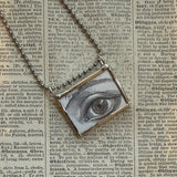 Human eye, antique woodcut illustrations up-cycled to soldered glass pendant
