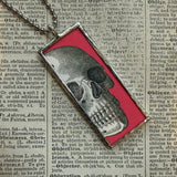 Skull and bats vintage halloween card illustrations, upcycled to hand-soldered glass pendant