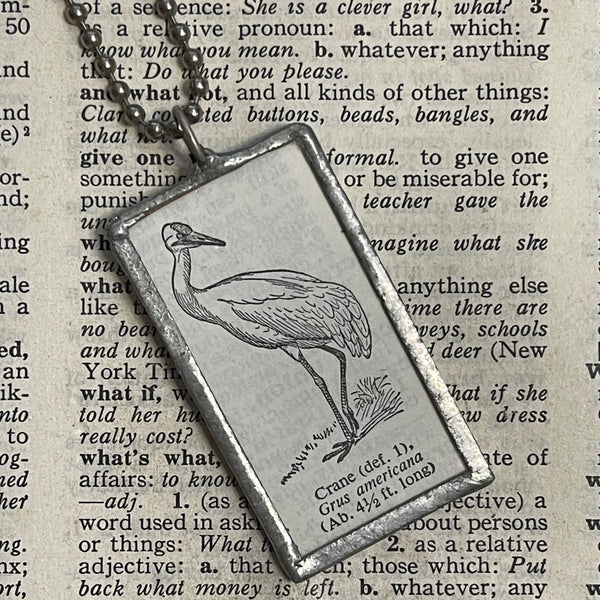 Crane, vintage 1930s dictionary illustration, upcycled to soldered glass pendant