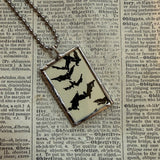 Raven and bats vintage halloween illustrations, upcycled to hand-soldered glass pendant