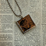 Skulls and skeletons vintage halloween illustrations, upcycled to hand-soldered glass pendant
