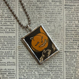 Pumpkins and jack o lanterns, vintage children's book illustrations, upcycled to soldered glass pendant
