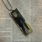 Cabinet of Dr. Caligari- vintage halloween illustrations, upcycled to hand-soldered glass pendant