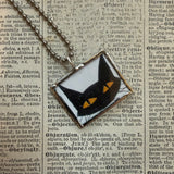 Black cat and evil smile, vintage halloween illustrations, upcycled to hand-soldered glass pendant
