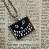 Black cat and evil smile, vintage halloween illustrations, upcycled to hand-soldered glass pendant