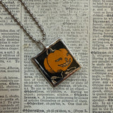 Pumpkin jack-o-lantern and black cat, vintage children's book illustrations, upcycled to soldered glass pendant